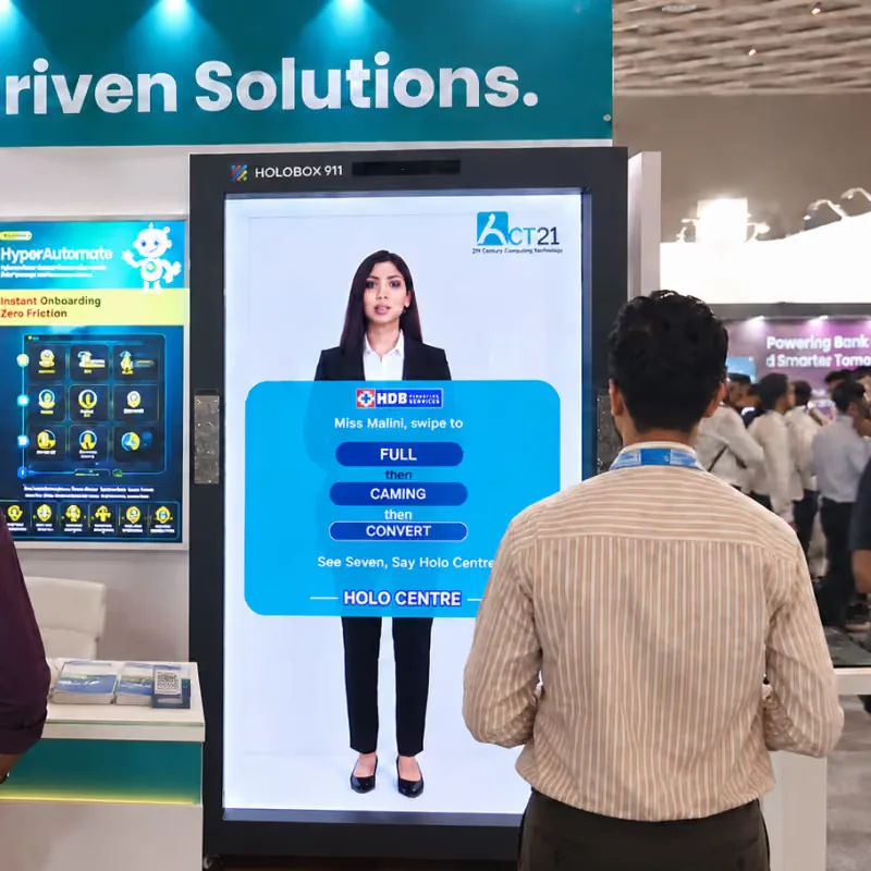 Visitor facing a life-size AI presenter on a HoloBox911 at Global Fintech Fest 2026