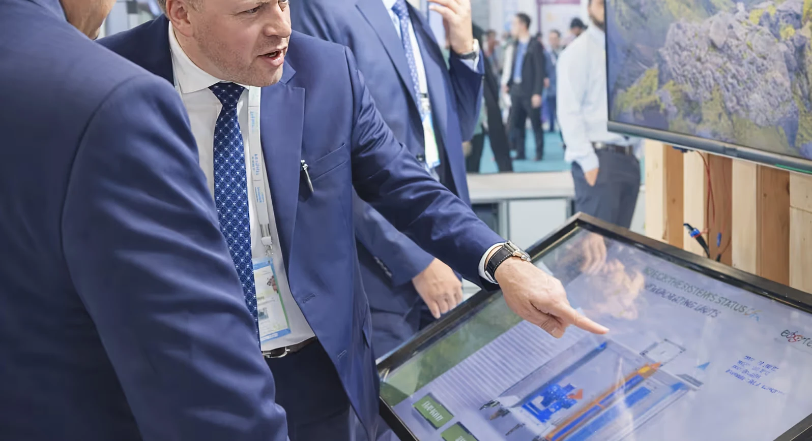 Sales professional presenting HVAC product range on interactive 3D demo app touchscreen